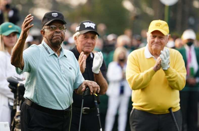 Apr 8, 2021; Augusta, Georgia, USA; Gary Player (middle) and Jack Nicklaus (right) clap as Lee Elder is introduced on the 1st tee during the first round of The Masters golf tournament. Mandatory Credit: Rob Schumacher-USA TODAY Sports