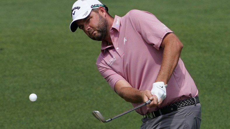 Apr 8, 2021; Augusta, Georgia, USA; Marc Leishman chips onto the 2nd green during the first round of The Masters golf tournament. Mandatory Credit: Michael Madrid-USA TODAY Sports