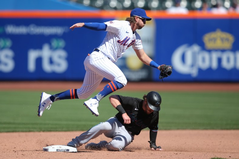 Apr 8, 2021; New York City, New York, USA; New York Mets second baseman Jeff McNeil (6) forces out Miami Marlins third baseman Brian Anderson (15) at second base on a fielders choice by right fielder Adam Duvall (not pictured) during the fifth inning of an opening day game at Citi Field. Mandatory Credit: Brad Penner-USA TODAY Sports