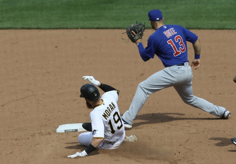 Apr 8, 2021; Pittsburgh, Pennsylvania, USA;  Pittsburgh Pirates third baseman Colin Moran (19) slides into second base with a double as Chicago Cubs second baseman David Bote (13) takes a throw during the fifth inning at PNC Park. Mandatory Credit: Charles LeClaire-USA TODAY Sports