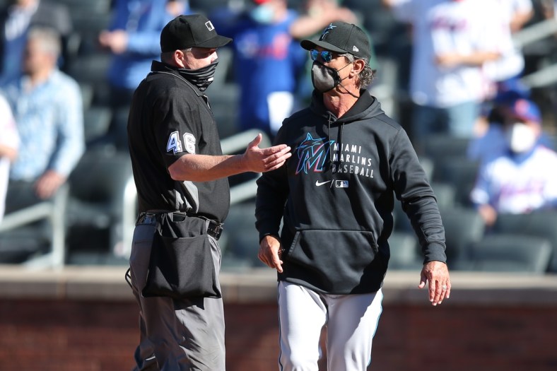Apr 8, 2021; New York City, New York, USA; Miami Marlins manager Don Mattingly argues with home plate umpire Ron Kulpa (46) after a hit by pitch forced in the winning run during the ninth inning of an opening day game against the New York Mets at Citi Field. Mandatory Credit: Brad Penner-USA TODAY Sports