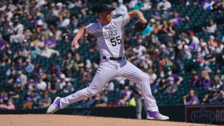 Apr 8, 2021; Denver, Colorado, USA; Colorado Rockies starting pitcher Jon Gray (55) delivers a pitch in the fifth inning against the Arizona Diamondbacks at Coors Field. Mandatory Credit: Ron Chenoy-USA TODAY Sports
