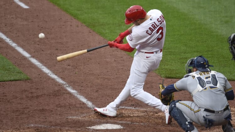 Apr 8, 2021; St. Louis, Missouri, USA; St. Louis Cardinals center fielder Dylan Carlson (3) hits a double against the Milwaukee Brewers in the seventh inning at Busch Stadium. Mandatory Credit: Joe Puetz-USA TODAY Sports