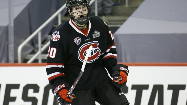 Apr 8, 2021; Pittsburgh, PA, USA; St. Cloud State Huskies forward Nolan Walker (20) celebrates his goal during the third period in the semifinals of the 2021 NCAA Frozen Four college hockey tournament against the Minnesota State Mavericks at PPG Paints Arena. Mandatory Credit: Charles LeClaire-USA TODAY Sports