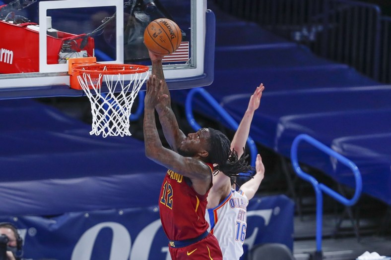 Apr 8, 2021; Oklahoma City, Oklahoma, USA; Cleveland Cavaliers forward Taurean Prince (12) goes to the basket ahead of Oklahoma City Thunder guard Ty Jerome (16) during the first quarter at Chesapeake Energy Arena. Mandatory Credit: Alonzo Adams-USA TODAY Sports