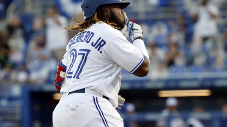 Apr 8, 2021; Dunedin, Florida, CAN; Toronto Blue Jays designated hitter Vladimir Guerrero Jr. (27) gestures as he runs the bases after hitting a two-run home run during the first inning against the Los Angeles Angels at TD Ballpark. Mandatory Credit: Kim Klement-USA TODAY Sports