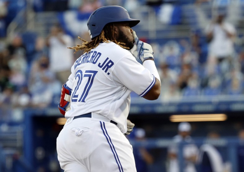 Apr 8, 2021; Dunedin, Florida, CAN; Toronto Blue Jays designated hitter Vladimir Guerrero Jr. (27) gestures as he runs the bases after hitting a two-run home run during the first inning against the Los Angeles Angels at TD Ballpark. Mandatory Credit: Kim Klement-USA TODAY Sports