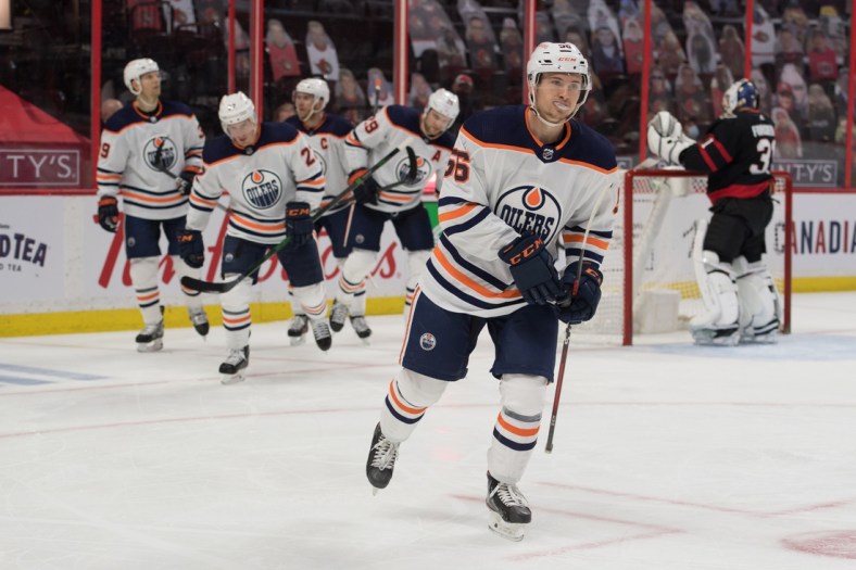 Apr 8, 2021; Ottawa, Ontario, CAN; Edmonton Oilers right wing Kailer Yamamoto (56) skates to the bench following a goal scored during the second period against the Ottawa Senators at the Canadian Tire Centre. Mandatory Credit: Marc DesRosiers-USA TODAY Sports