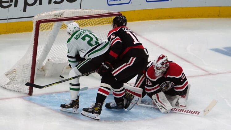 Apr 8, 2021; Chicago, Illinois, USA; Dallas Stars left wing Jason Robertson (21) scores a goal on Chicago Blackhawks goaltender Kevin Lankinen (32) during the second period at United Center. Mandatory Credit: David Banks-USA TODAY Sports