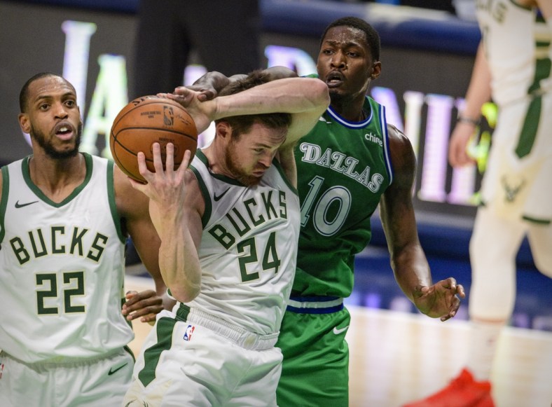 Apr 8, 2021; Dallas, Texas, USA; Milwaukee Bucks guard Pat Connaughton (24) and Dallas Mavericks forward Dorian Finney-Smith (10) fight for the rebound during the second quarter at the American Airlines Center. Mandatory Credit: Jerome Miron-USA TODAY Sports