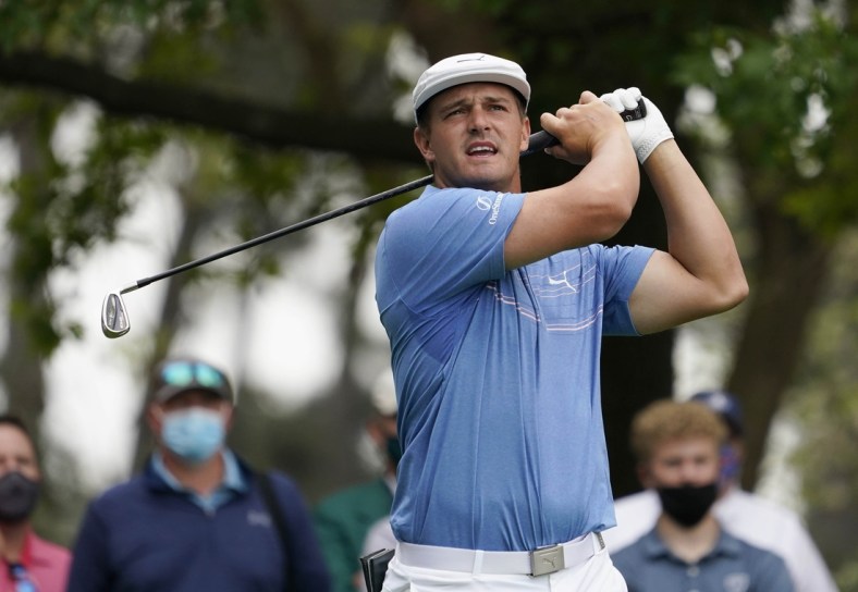 Apr 9, 2021; Augusta, Georgia, USA; Bryson DeChambeau hits his tee shot on the 4th hole during the second round of The Masters golf tournament. Mandatory Credit: Rob Schumacher-USA TODAY Sports