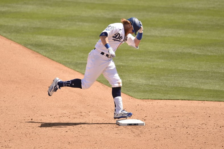 Apr 9, 2021; Los Angeles, California, USA; Los Angeles Dodgers third baseman Justin Turner (10) rounds the bases after hitting a solo home run during the sixth inning against the Washington Nationals at Dodger Stadium. Mandatory Credit: Kelvin Kuo-USA TODAY Sports