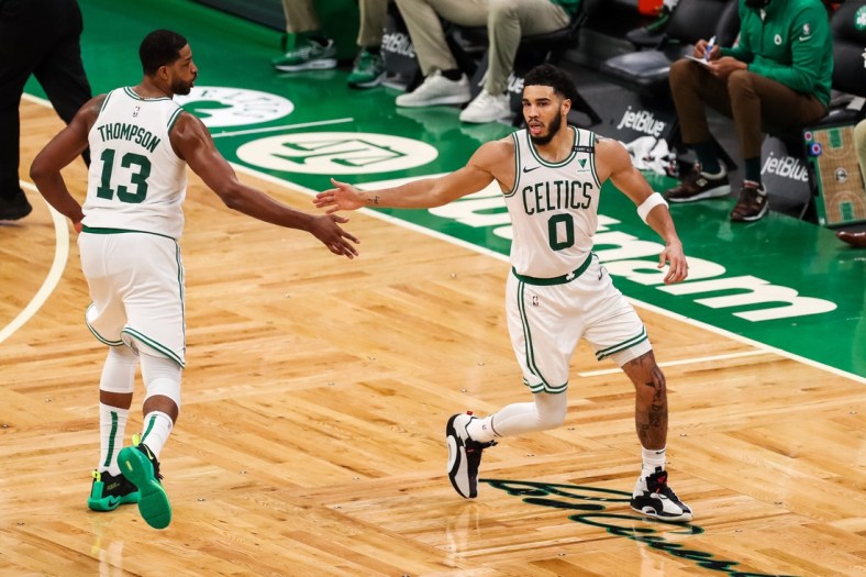 Apr 9, 2021; Boston, Massachusetts, USA; Boston Celtics forward Jayson Tatum (0) reacts after making a shot during the second half against the Minnesota Timberwolves at TD Garden. Mandatory Credit: Paul Rutherford-USA TODAY Sports