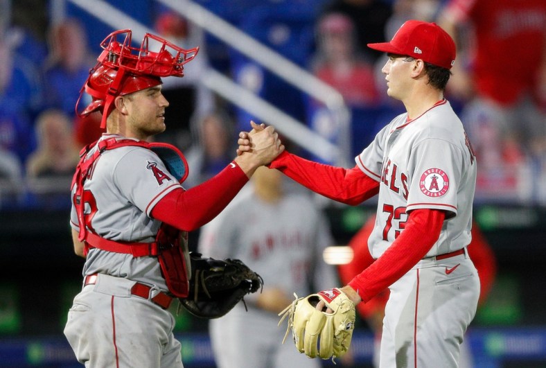 Apr 9, 2021; Dunedin, Florida, CAN; Los Angeles Angels starting pitcher Chris Rodriguez (73) congratulates catcher Max Stassi (33) after beating the Toronto Blue Jays 7-1 at TD Ballpark. Mandatory Credit: Nathan Ray Seebeck-USA TODAY Sports