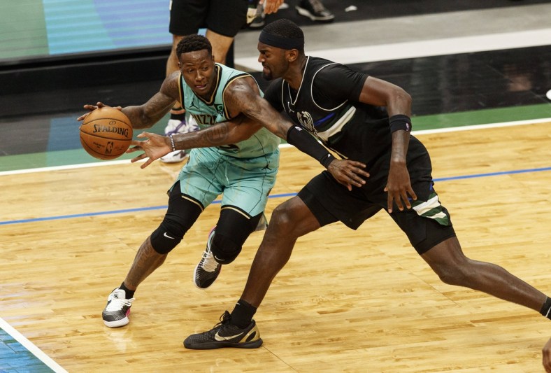 Apr 9, 2021; Milwaukee, Wisconsin, USA; Milwaukee Bucks forward Bobby Portis (9) reaches for the ball controlled by Charlotte Hornets guard Terry Rozier (3)  during the third quarter at Fiserv Forum. Mandatory Credit: Jeff Hanisch-USA TODAY Sports