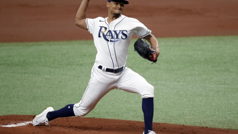 Apr 10, 2021; St. Petersburg, Florida, USA; Tampa Bay Rays starting pitcher Chris Archer (22) throws a pitch during the first inning against the New York Yankees at Tropicana Field. Mandatory Credit: Kim Klement-USA TODAY Sports