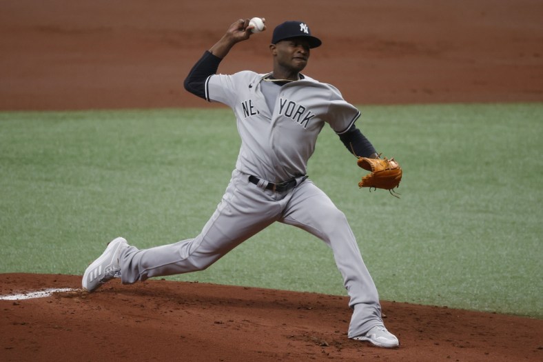 Apr 10, 2021; St. Petersburg, Florida, USA; New York Yankees starting pitcher Domingo German (55) throws a pitch during the first inning against the Tampa Bay Rays at Tropicana Field. Mandatory Credit: Kim Klement-USA TODAY Sports