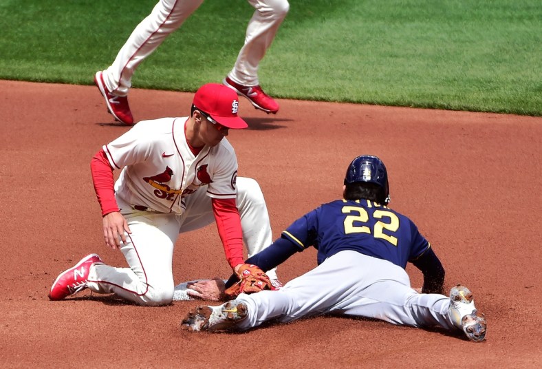 Apr 10, 2021; St. Louis, Missouri, USA;  St. Louis Cardinals second baseman Tommy Edman (19) is unable to tag out Milwaukee Brewers left fielder Christian Yelich (22) as he steals second during the first inning at Busch Stadium. Mandatory Credit: Jeff Curry-USA TODAY Sports