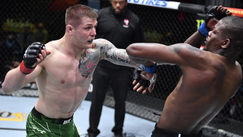 April 10, 2021; Las Vegas, NV, USA;   Marvin Vettori of Italy punches Kevin Holland in a middleweight fight during the UFC Fight Night event at UFC APEX on April 10, 2021 in Las Vegas, Nevada. Mandatory Credit: Chris Unger/Handout Photo via USA TODAY Sports