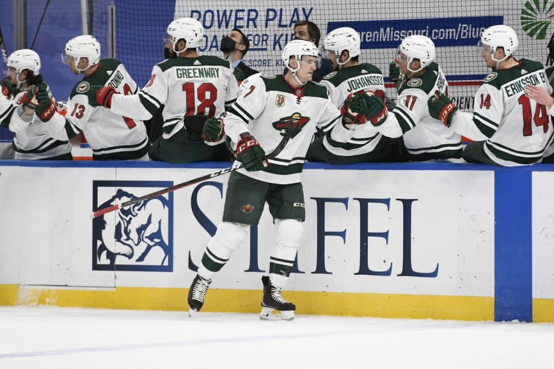 Apr 10, 2021; St. Louis, Missouri, USA; Minnesota Wild center Nico Sturm (7) is congratulated by teammates after scoring a goal against the St. Louis Blues in the first period at Enterprise Center. Mandatory Credit: Jeff Le-USA TODAY Sports