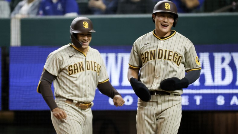 Apr 10, 2021; Arlington, Texas, USA;  San Diego Padres center fielder Trent Grisham (left) celebrates with shortstop Ha-Seong Kim (7) after hitting a home run during the seventh inning against the Texas Rangers at Globe Life Field. Mandatory Credit: Kevin Jairaj-USA TODAY Sports