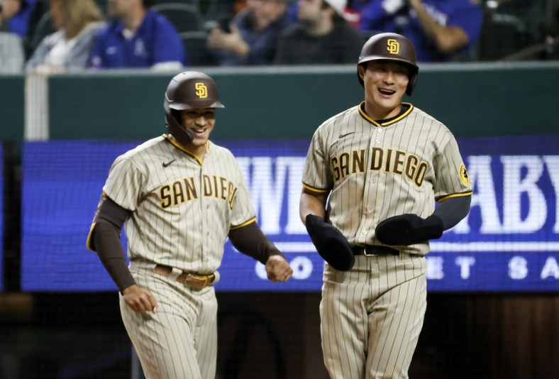 Apr 10, 2021; Arlington, Texas, USA;  San Diego Padres center fielder Trent Grisham (left) celebrates with shortstop Ha-Seong Kim (7) after hitting a home run during the seventh inning against the Texas Rangers at Globe Life Field. Mandatory Credit: Kevin Jairaj-USA TODAY Sports