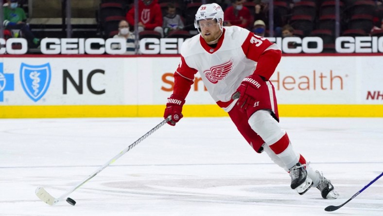 Apr 10, 2021; Raleigh, North Carolina, USA;  Detroit Red Wings right wing Anthony Mantha (39) skates with the puck against the Carolina Hurricanes at PNC Arena. Mandatory Credit: James Guillory-USA TODAY Sports