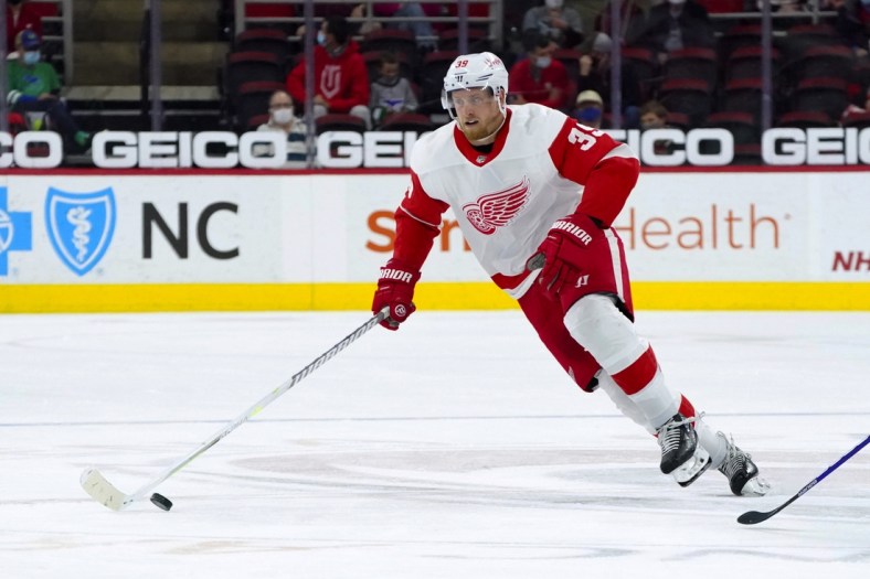 Apr 10, 2021; Raleigh, North Carolina, USA;  Detroit Red Wings right wing Anthony Mantha (39) skates with the puck against the Carolina Hurricanes at PNC Arena. Mandatory Credit: James Guillory-USA TODAY Sports