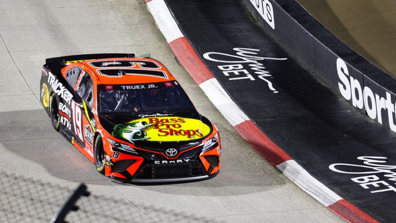 Apr 10, 2021; Martinsville, Virginia, USA; NASCAR Cup Series driver Martin Truex Jr. (19) races at the Blue-Emu Maximum Pain Relief 500 at Martinsville Speedway. Mandatory Credit: Ryan Hunt-USA TODAY Sports