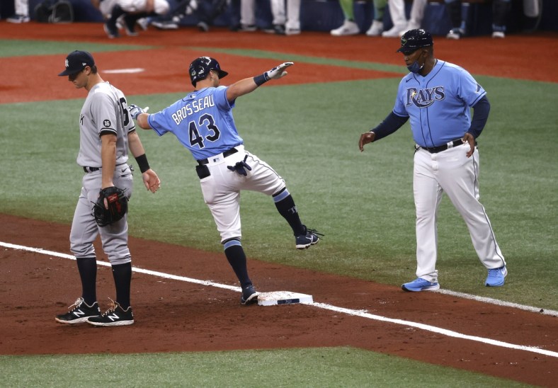 Apr 11, 2021; St. Petersburg, Florida, USA; Tampa Bay Rays third baseman Mike Brosseau (43) singles during the second inning against the New York Yankees at Tropicana Field. Mandatory Credit: Kim Klement-USA TODAY Sports