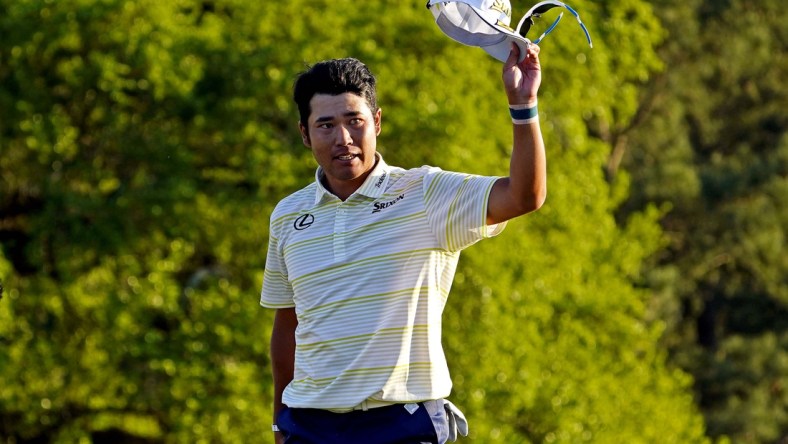 Apr 11, 2021; Augusta, Georgia, USA; Hideki Matsuyama reacts on the 18th green after winning The Masters golf tournament. Mandatory Credit: Michael Madrid-USA TODAY Sports