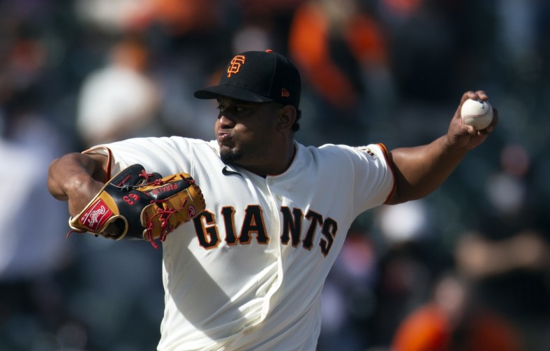 Apr 11, 2021; San Francisco, California, USA; San Francisco Giants pitcher Wandy Peralta (60) delivers a pitch against the Colorado Rockies during the ninth inning of a Major League Baseball game at Oracle Park. Mandatory Credit: D. Ross Cameron-USA TODAY Sports