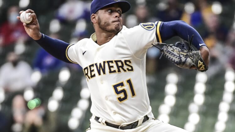Apr 12, 2021; Milwaukee, Wisconsin, USA; Milwaukee Brewers pitcher Freddy Peralta (51) throws a pitch in the first inning against the Chicago Cubs at American Family Field. Mandatory Credit: Benny Sieu-USA TODAY Sports