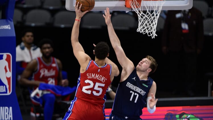 Apr 12, 2021; Dallas, Texas, USA; Dallas Mavericks guard Luka Doncic (77) guards Philadelphia 76ers guard Ben Simmons (25) during the first quarter at the American Airlines Center. Mandatory Credit: Jerome Miron-USA TODAY Sports