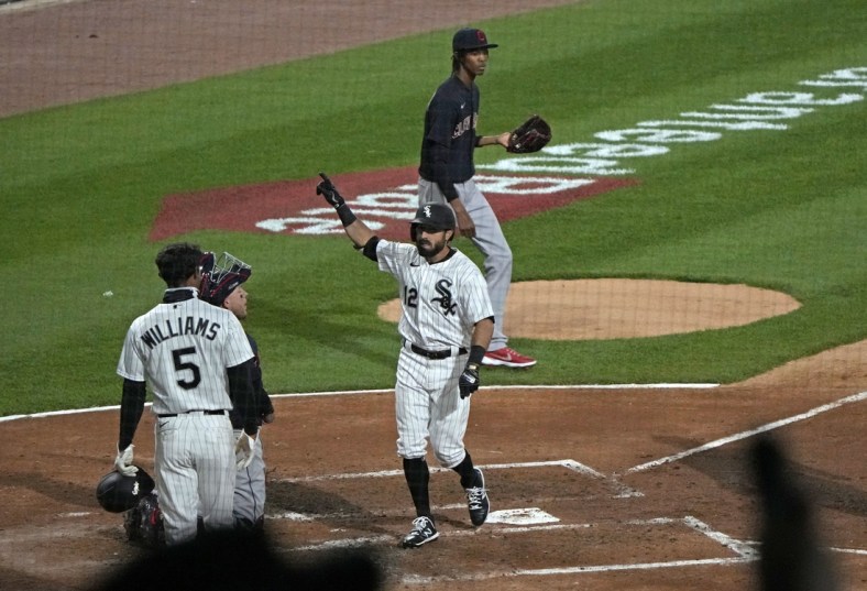 Apr 12, 2021; Chicago, Illinois, USA; Chicago White Sox right fielder Adam Eaton (12) reacts after hitting a three run home run against Cleveland Indians starting pitcher Triston McKenzie (24) during the third inning at Guaranteed Rate Field. Mandatory Credit: Mike Dinovo-USA TODAY Sports