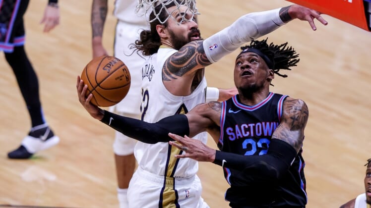Apr 12, 2021; New Orleans, Louisiana, USA; New Orleans Pelicans center Steven Adams (12) defends the basket against Sacramento Kings center Richaun Holmes (22) during the first half at Smoothie King Center. Mandatory Credit: Stephen Lew-USA TODAY Sports