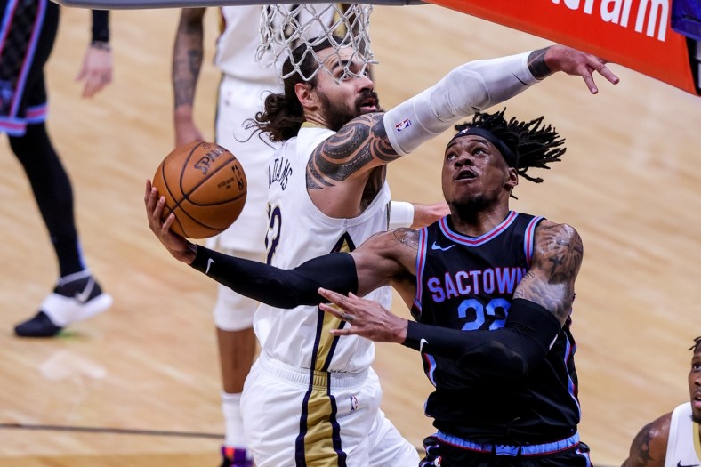 Apr 12, 2021; New Orleans, Louisiana, USA; New Orleans Pelicans center Steven Adams (12) defends the basket against Sacramento Kings center Richaun Holmes (22) during the first half at Smoothie King Center. Mandatory Credit: Stephen Lew-USA TODAY Sports