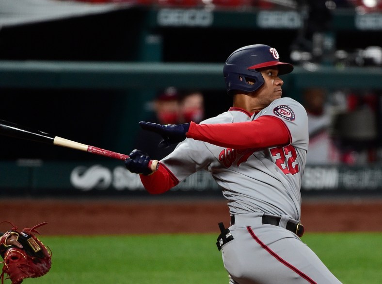 Apr 12, 2021; St. Louis, Missouri, USA;  Washington Nationals right fielder Juan Soto (22) hits a single during the sixth inning against the St. Louis Cardinals at Busch Stadium. Mandatory Credit: Jeff Curry-USA TODAY Sports