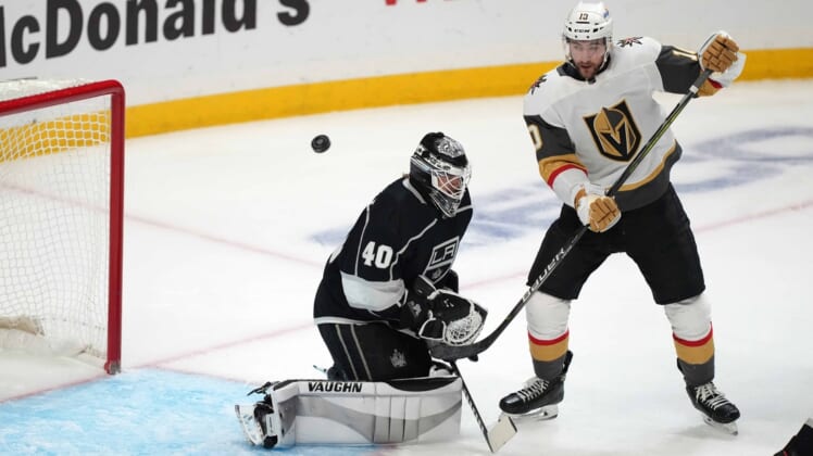 Apr 12, 2021; Los Angeles, California, USA; LA Kings goaltender Calvin Petersen (40) defends the goal against Vegas Golden Knights center Nicolas Roy (10) in the second period at Staples Center. Mandatory Credit: Kirby Lee-USA TODAY Sports