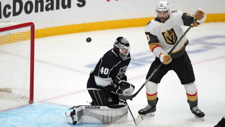 Apr 12, 2021; Los Angeles, California, USA; LA Kings goaltender Calvin Petersen (40) defends the goal against Vegas Golden Knights center Nicolas Roy (10) in the second period at Staples Center. Mandatory Credit: Kirby Lee-USA TODAY Sports