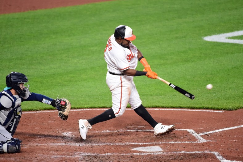 Apr 13, 2021; Baltimore, Maryland, USA; Baltimore Orioles third baseman Maikel Franco (3) hits a three run double in the third inning against the Seattle Mariners at Oriole Park at Camden Yards. Mandatory Credit: Evan Habeeb-USA TODAY Sports