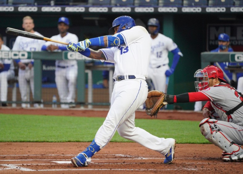 Apr 13, 2021; Kansas City, Missouri, USA; Kansas City Royals catcher Salvador Perez (13) hits a double during the first inning against the Los Angeles Angels at Kauffman Stadium. Mandatory Credit: Denny Medley-USA TODAY Sports