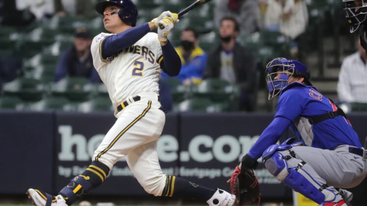 Apr 13, 2021; Milwaukee, Wisconsin, USA; Milwaukee Brewers third baseman Luis Urias (2) hits a two-run home run against the Chicago Cubs during the second inning at American Family Field. Mandatory Credit: Mark Hoffman/Milwaukee Journal Sentinel via USA TODAY NETWORK