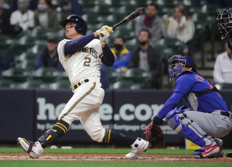 Apr 13, 2021; Milwaukee, Wisconsin, USA; Milwaukee Brewers third baseman Luis Urias (2) hits a two-run home run against the Chicago Cubs during the second inning at American Family Field. Mandatory Credit: Mark Hoffman/Milwaukee Journal Sentinel via USA TODAY NETWORK