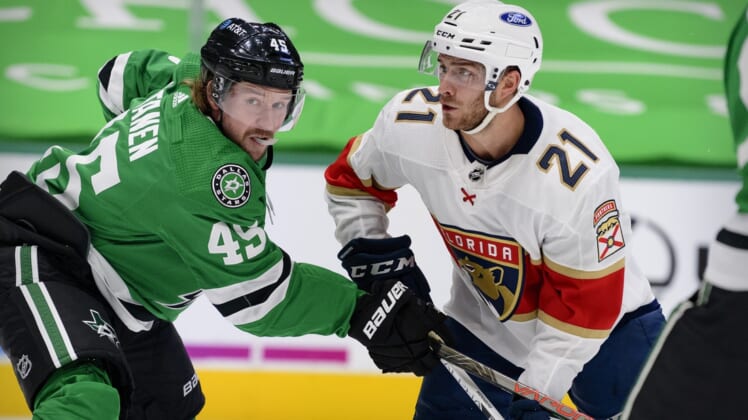 Apr 13, 2021; Dallas, Texas, USA; Dallas Stars defenseman Sami Vatanen (45) defends against Florida Panthers center Alex Wennberg (21) during the first period at the American Airlines Center. Mandatory Credit: Jerome Miron-USA TODAY Sports