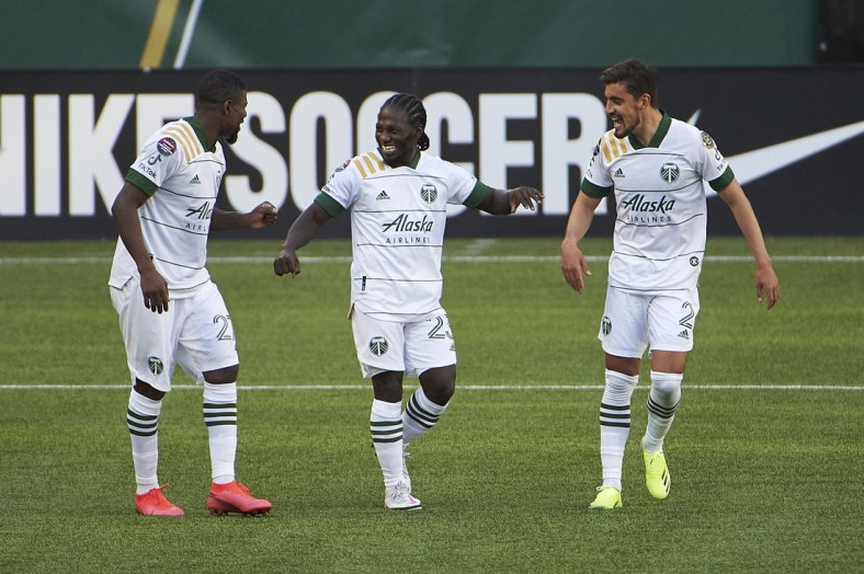 Apr 13, 2021; Portland, Oregon, USA; Portland Timbers forward Yimmi Chara (23) celebrates with teammates after scoring a goal during the second half against Marathon at Providence Park. Mandatory Credit: Troy Wayrynen-USA TODAY Sports
