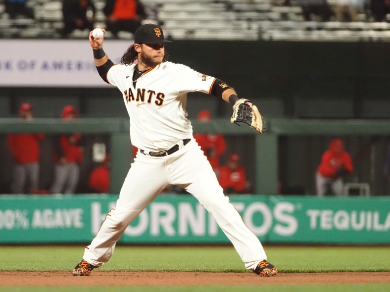 Apr 13, 2021; San Francisco, California, USA; San Francisco Giants shortstop Brandon Crawford (35) throws to first base against the Cincinnati Reds during the fifth inning at Oracle Park. Mandatory Credit: Kelley L Cox-USA TODAY Sports
