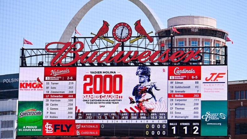 Apr 14, 2021; St. Louis, Missouri, USA;  The St. Louis Cardinals salute catcher Yadier Molina (4) for starting his 2,000 game as catcher for one organization during the first inning against the Washington Nationals at Busch Stadium. Mandatory Credit: Jeff Curry-USA TODAY Sports