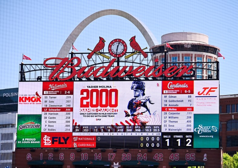 Apr 14, 2021; St. Louis, Missouri, USA;  The St. Louis Cardinals salute catcher Yadier Molina (4) for starting his 2,000 game as catcher for one organization during the first inning against the Washington Nationals at Busch Stadium. Mandatory Credit: Jeff Curry-USA TODAY Sports