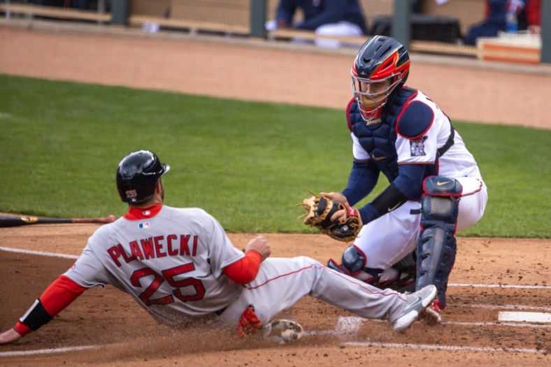 Apr 14, 2021; Minneapolis, Minnesota, USA; Boston Red Sox catcher Kevin Plawecki (25) gets tagged out at home plate from Minnesota Twins catcher Ryan Jeffers (27) in the second inning at Target Field. Mandatory Credit: Jesse Johnson-USA TODAY Sports